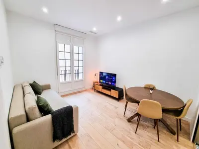 Una televisión o centro de entretenimiento en Pilar Dreams ComoTuCasa