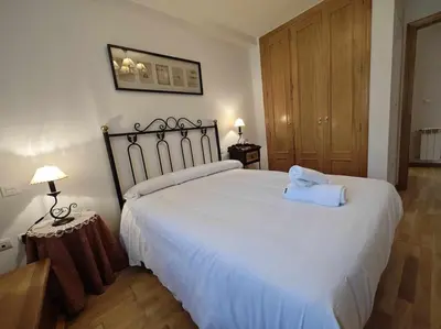 Cama o camas de una habitación en Sarriales II tucasaenlospirineos