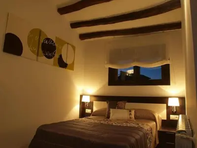 Cama o camas de una habitación en Apartamentos Berdiel
