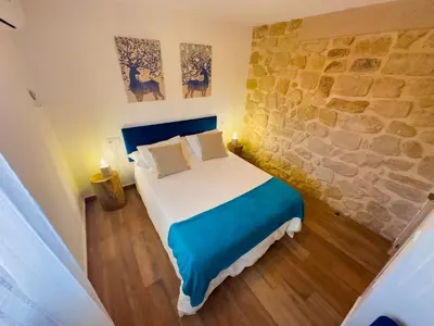 Cama o camas de una habitación en Casa Rural Claudia