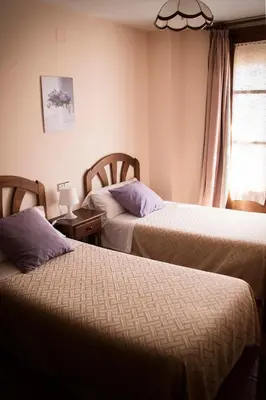 Cama o camas de una habitación en Pension Las Cuevas de Cañart