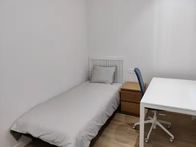 Cama o camas de una habitación en Apartamentos Ezkaba by Clabao