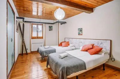 Cama o camas de una habitación en Casa Rural Arix by Cardi Suites