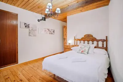 Cama o camas de una habitación en Casa Rural Arix by Cardi Suites