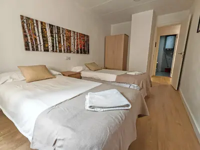 Cama o camas de una habitación en Boutique 2 apartamento Ave centro Lleida