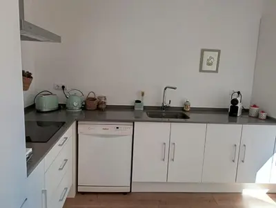 Una cocina o zona de cocina en Com a casa