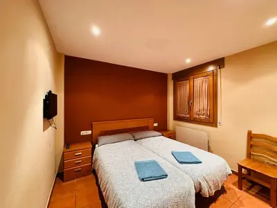Cama o camas de una habitación en Pirineos como en casa 2