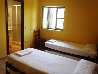 Cama o camas de una habitación en Albergue Las Almunias