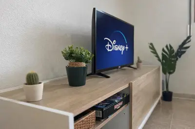 Una televisión o centro de entretenimiento en Apto Espert l Cine l Garaje l BBQ I Tenis l Wifi