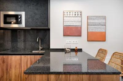 Una cocina o zona de cocina en Apartamentos Torre del Reloj