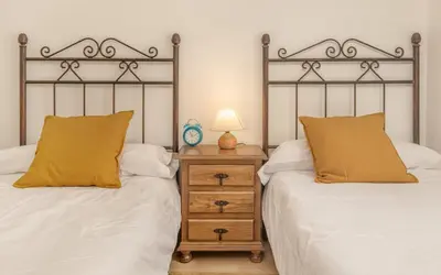 Cama o camas de una habitación en Alojamiento Sebastian II Biescas