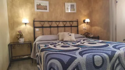 Cama o camas de una habitación en La Palmera de la Insula