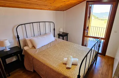 Cama o camas de una habitación en CASA COTIELLA RAÑIN