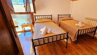 Cama o camas de una habitación en CASA COTIELLA RAÑIN