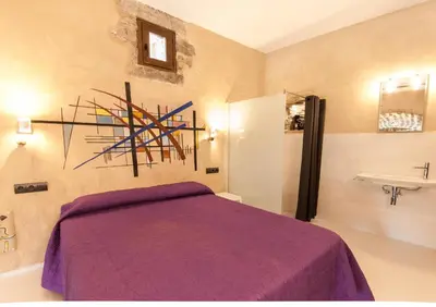 Cama o camas de una habitación en Casa Mur de Alujan