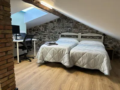 Cama o camas de una habitación en Ático abuhardillado imak Jaca