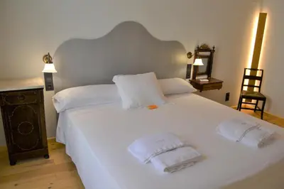 Cama o camas de una habitación en Lo Palauet de la Muralla