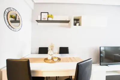 Una televisión o centro de entretenimiento en Apartamento moderno y céntrico en Huesca ciudad