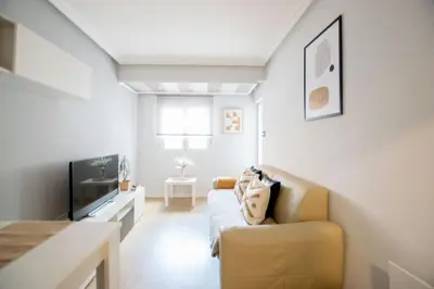 Una televisión o centro de entretenimiento en Apartamento moderno y céntrico en Huesca ciudad