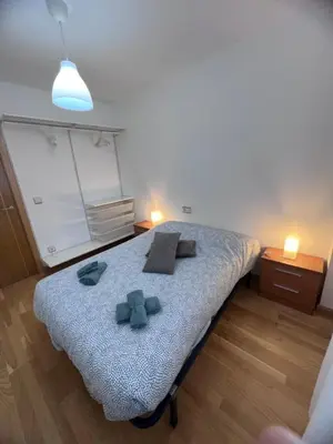 Cama o camas de una habitación en Apartamento en Sabiñánigo para grupos con amplia y soleada terraza