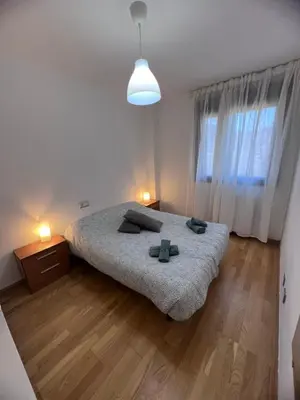 Cama o camas de una habitación en Apartamento en Sabiñánigo para grupos con amplia y soleada terraza