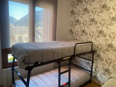 Cama o camas de una habitación en Apto en Campo Valle de Benasque 2 dormitorios Wifi
