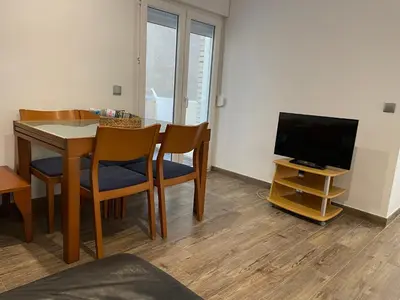 Una televisión o centro de entretenimiento en Apartament dels Mestres