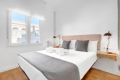 Cama o camas de una habitación en Hogar Lujoso Centro Zaragoza