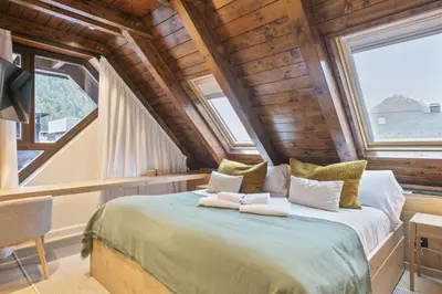 Cama o camas de una habitación en Luderna - Tríplex Val de Ruda C305