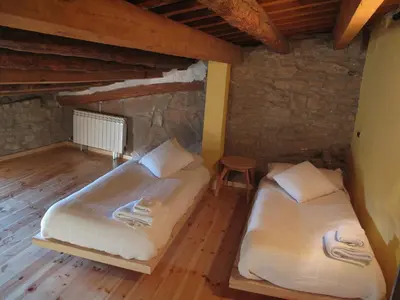 Cama o camas de una habitación en L'Esgolfa de ca l'Ortís