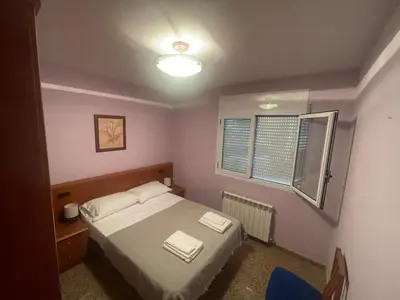Cama o camas de una habitación en Apartamentos Villa de Ainsa