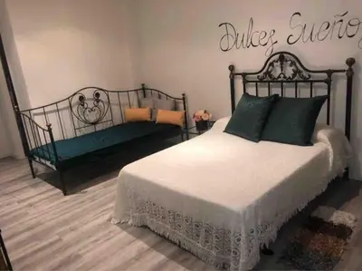 Cama o camas de una habitación en Loft LVU en Zaragoza