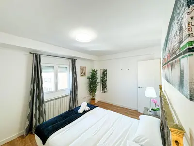 Cama o camas de una habitación en El Puente del Pilar - Turistea Suites