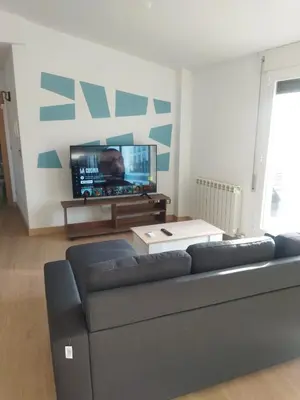 Una televisión o centro de entretenimiento en Ático Entero con Habitación en Corella