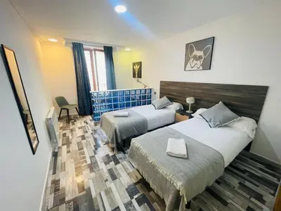 Cama o camas de una habitación en Fabuloso en el corazón de la ciudad y con garaje