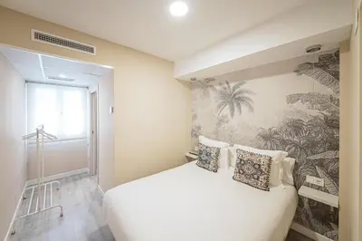 Cama o camas de una habitación en Hostal Plaza Boutique - Solo adultos