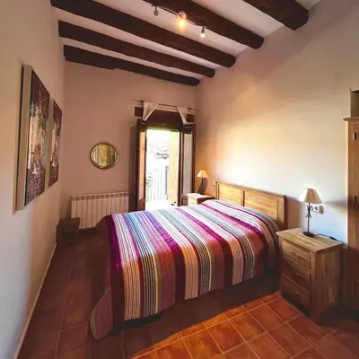 Cama o camas de una habitación en Apartamentos Angelus Plaza Mayor de Graus