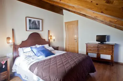 Cama o camas de una habitación en Apartamentos El Rincón de Benás