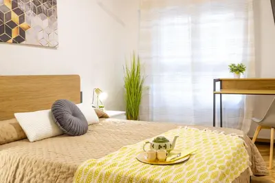 Cama o camas de una habitación en Los Sauces Pamplona Hospitales Universidad