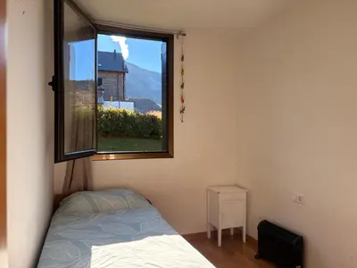 Cama o camas de una habitación en Planta baja y jardín-Paz, naturaleza y comodidad - Aüt 1