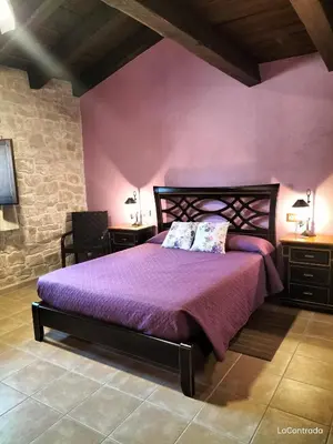 Cama o camas de una habitación en La Contrada