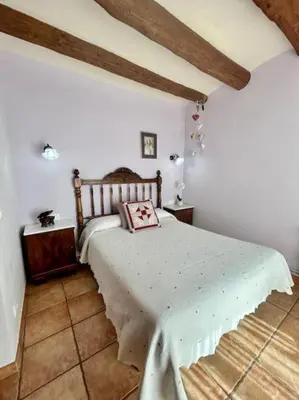 Cama o camas de una habitación en CAL JOAN pallars
