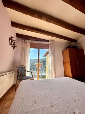 Cama o camas de una habitación en CAL JOAN pallars