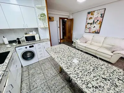 Una cocina o zona de cocina en A Orillas del Pilar con parking