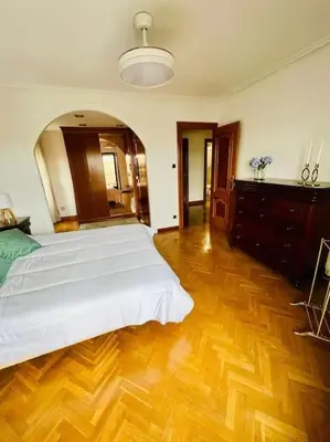 Cama o camas de una habitación en A Orillas del Pilar con parking