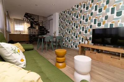 Una televisión o centro de entretenimiento en Apartamentos La Escapada