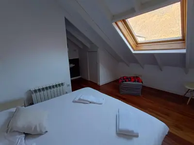 Cama o camas de una habitación en Inmocyma Los Escuadros-Benasque