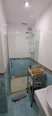 Un baño de Triplex Deluxe con terrazas al Pirineo y Golf