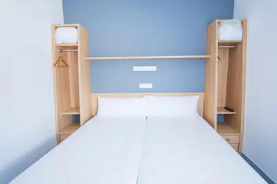 Cama o camas de una habitación en Alda Egues Rooms