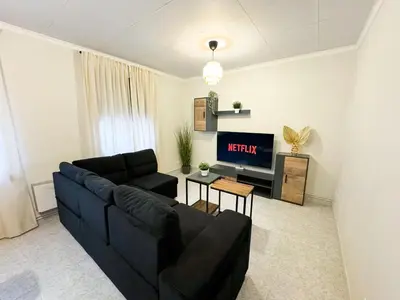 Zona de estar de La Paloma del Pilar - Turistea Suites